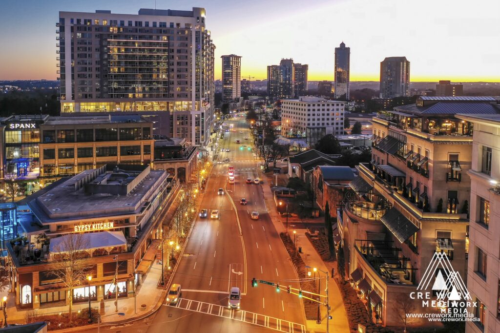 Peachtree Road in Buckhead Village at dusk with the Atlanta skyline